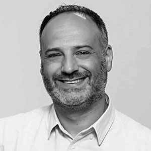 Speaker | Black and white photo of Andrew Montlake
