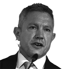Speaker | Black and white photo of Paul Adams